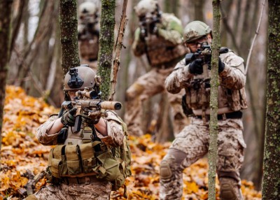 Soldier wearing tactical goggles, body armor and ballistic helmet